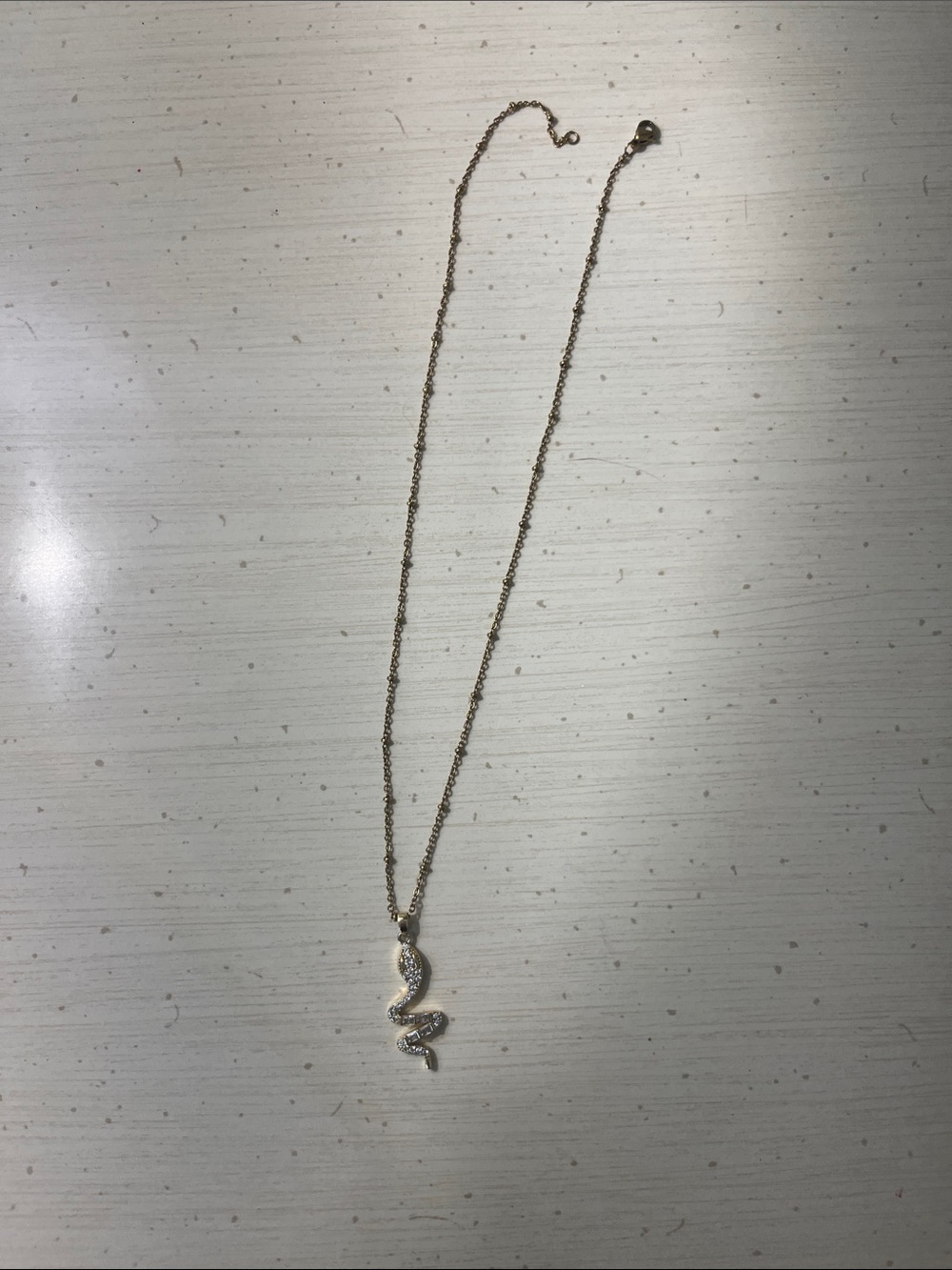 Delicate Gold Snake Pendant Necklace - Sparkling Accent